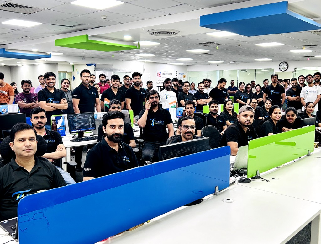 Triazine Software team celebrating growth and delivery milestones